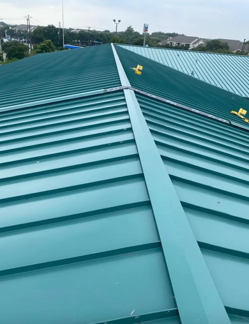 Green commercial metal roof ridge and valley for Metal Roof Repair in Hudson
